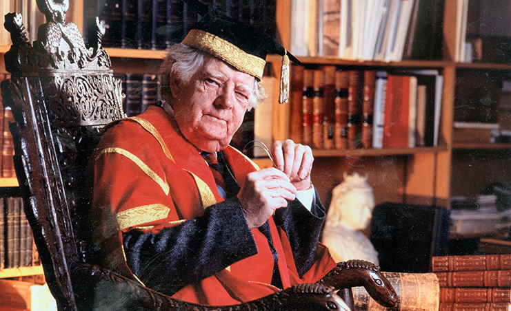 Northrop Frye in academic regalia, E.J. Pratt Library, Chief Librarian's office, 1990