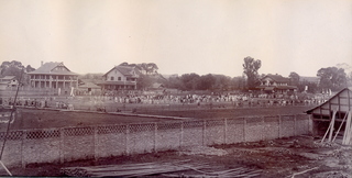 Western Union University, buildings and community in the playing fields, Chengtu. c1915 Credit: Johns Family.