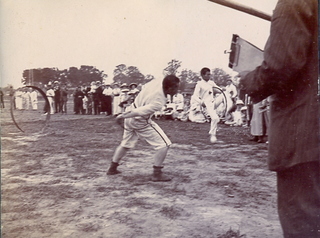 Chengtu sports day, c1915. (Man pitching a cricket ball?) Credit: Johns Family.