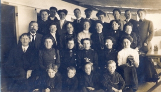 Missionaries on board a steamer, [about 1910] Credit: Johns Family.