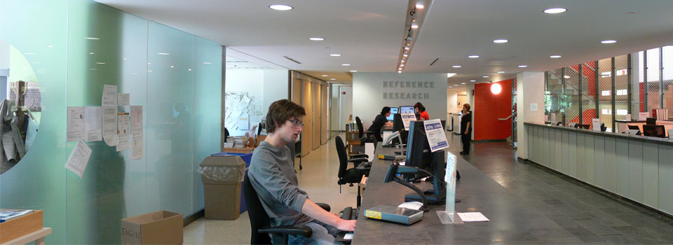 Image of the circulation desk on the main floor where users sign out library materials.